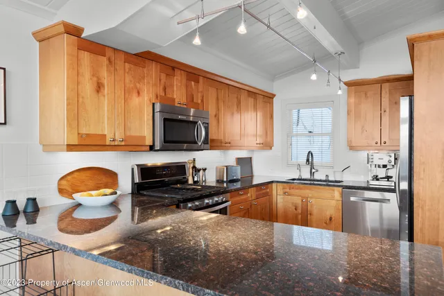 an aerial view of a house with a garden