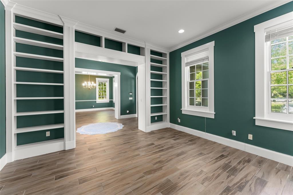 403 Water Street Celebration, FL 34747 - Photo 11 of 86 wooden floor in an empty room with a window