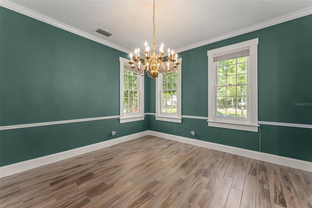 403 Water Street Celebration, FL 34747 - Photo 13 of 86 a view of room with window and wooden floor