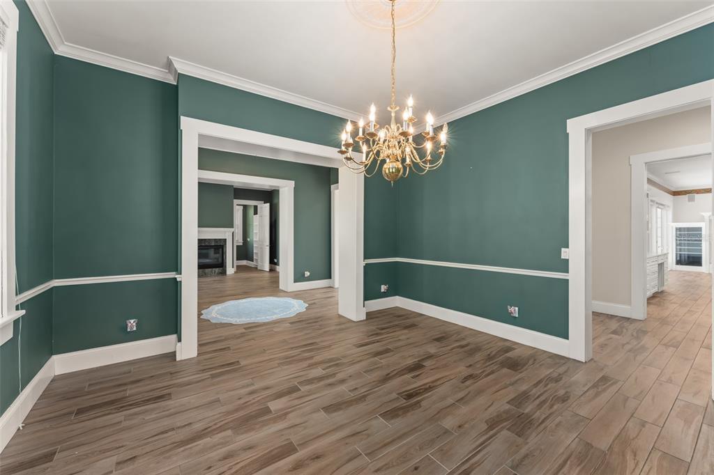 403 Water Street Celebration, FL 34747 - Photo 14 of 86 wooden floor in an empty room with a window