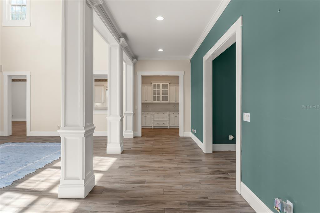 403 Water Street Celebration, FL 34747 - Photo 18 of 86 a view of a hallway with wooden floor and staircase