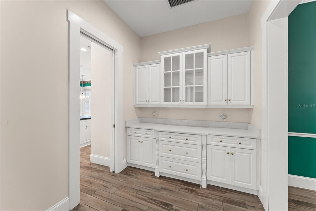 403 Water Street Celebration, FL 34747 - Photo 25 of 86 an empty room with wooden floor and cabinet