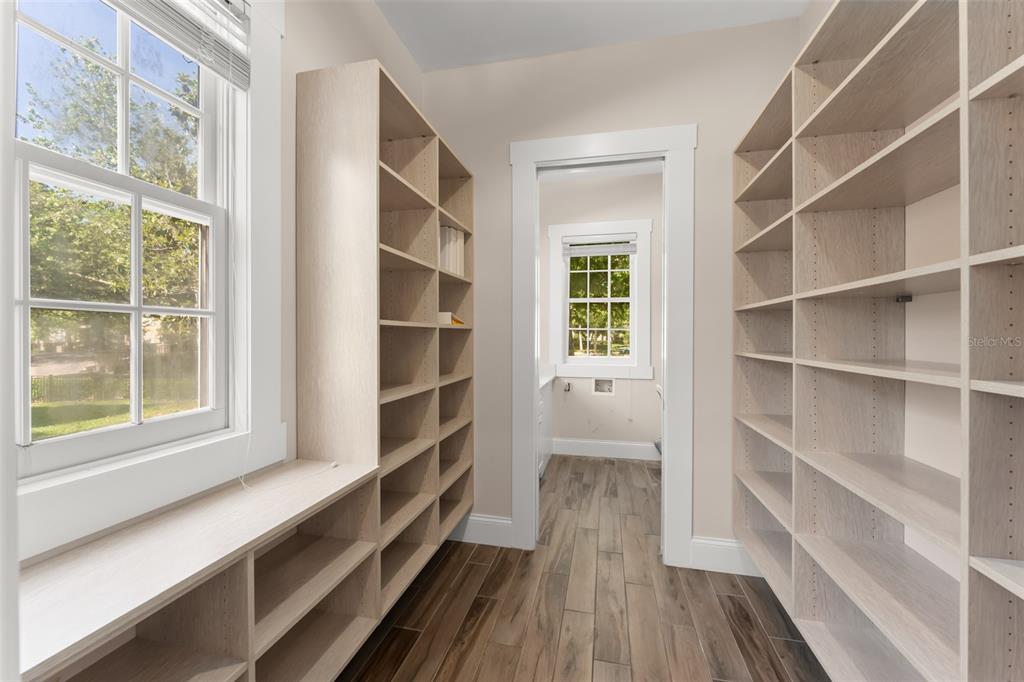 403 Water Street Celebration, FL 34747 - Photo 35 of 86 a view of a room with shelves on the wall