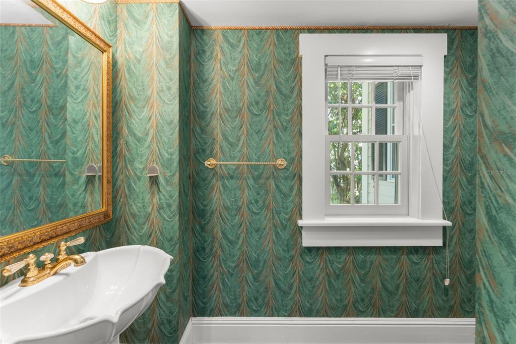 403 Water Street Celebration, FL 34747 - Photo 36 of 86 a bathroom with a sink a mirror and a shower