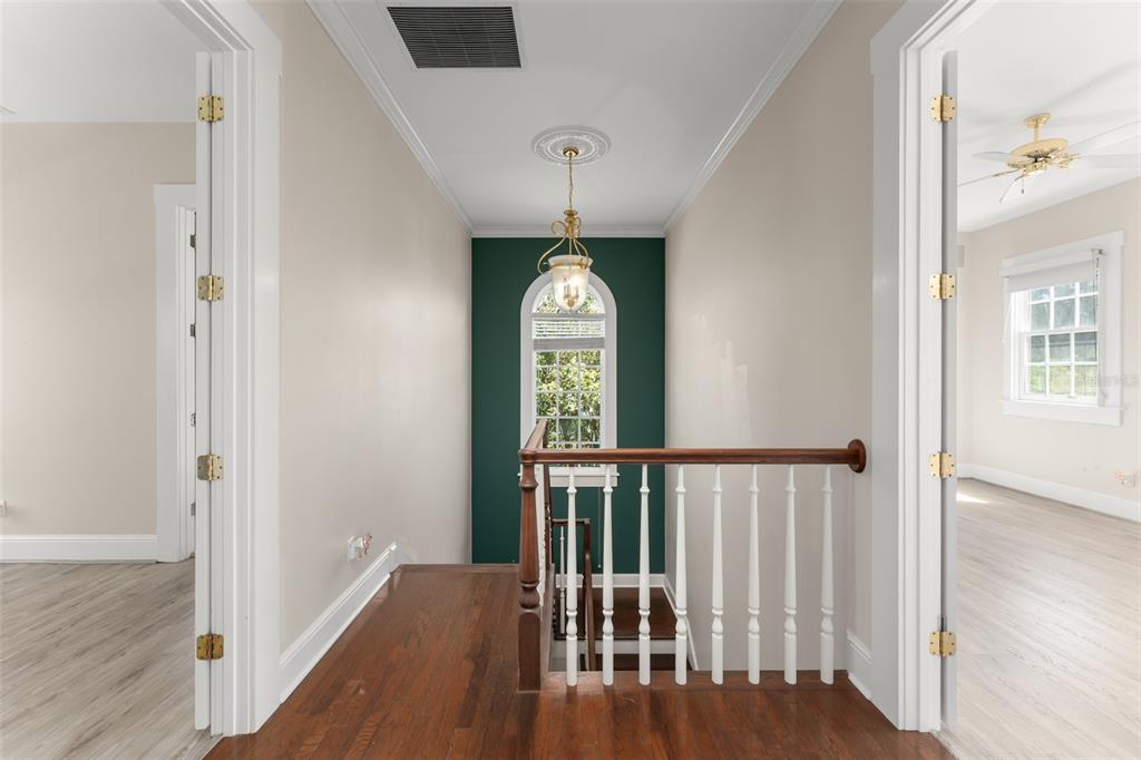 403 Water Street Celebration, FL 34747 - Photo 47 of 86 a view of a hallway with wooden floor windows and stairs