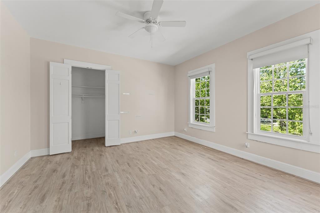 403 Water Street Celebration, FL 34747 - Photo 53 of 86 a view of an empty room with wooden floor and a window