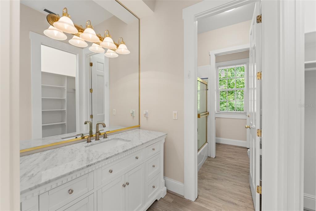 403 Water Street Celebration, FL 34747 - Photo 59 of 86 a bathroom with a double vanity sink and a mirror