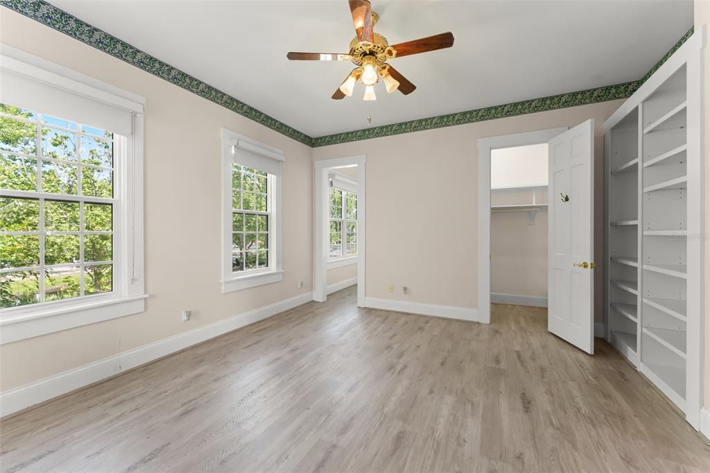 403 Water Street Celebration, FL 34747 - Photo 62 of 86 a view of an empty room with a window and wooden floor