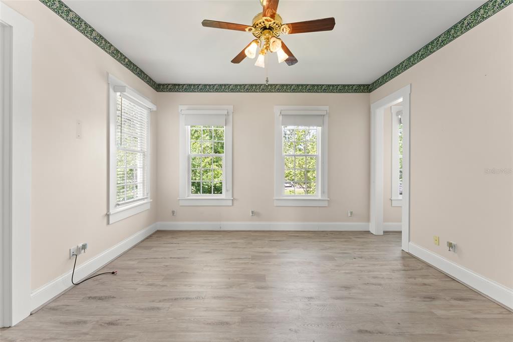 403 Water Street Celebration, FL 34747 - Photo 63 of 86 wooden floor in an empty room with a window