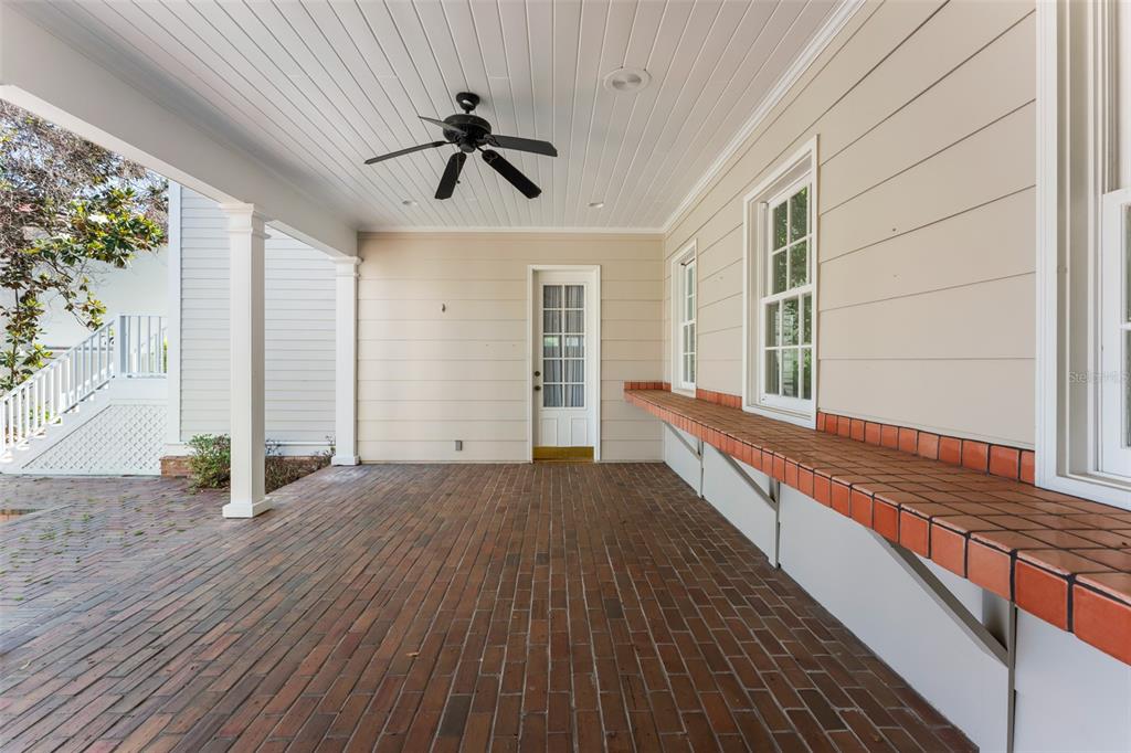 403 Water Street Celebration, FL 34747 - Photo 66 of 86 a view of a room with wooden floor and fan