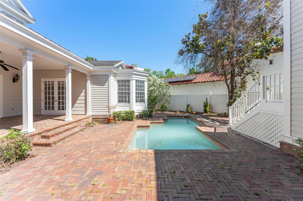 403 Water Street Celebration, FL 34747 - Photo 69 of 86 a view of a house with backyard and sitting area