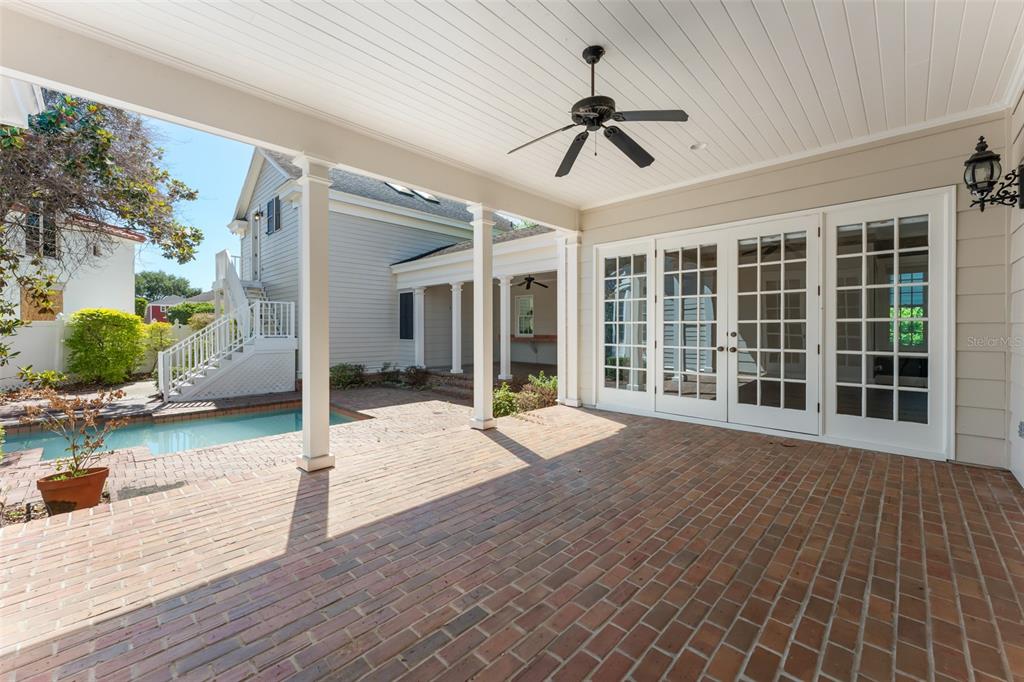 403 Water Street Celebration, FL 34747 - Photo 71 of 86 a view of a livingroom with wooden floor and ceiling fan