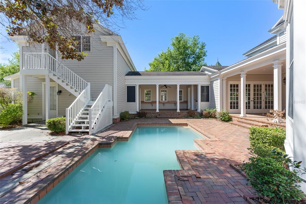 403 Water Street Celebration, FL 34747 - Photo 73 of 86 a view of a house with backyard porch and sitting area