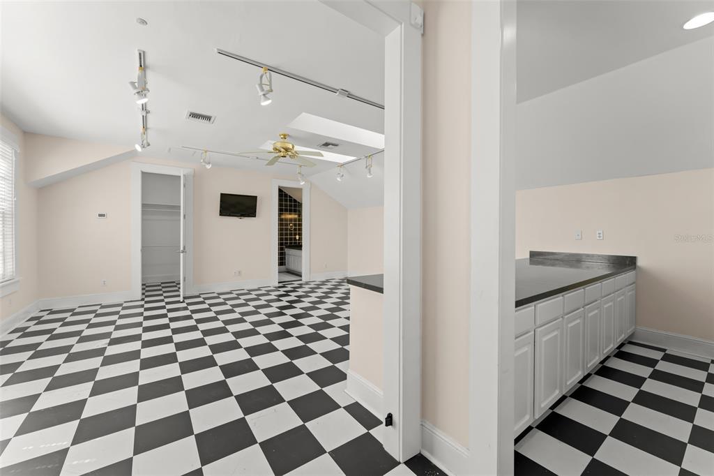 403 Water Street Celebration, FL 34747 - Photo 75 of 86 a bathroom with a black white checkered floor and a black white checkered floor