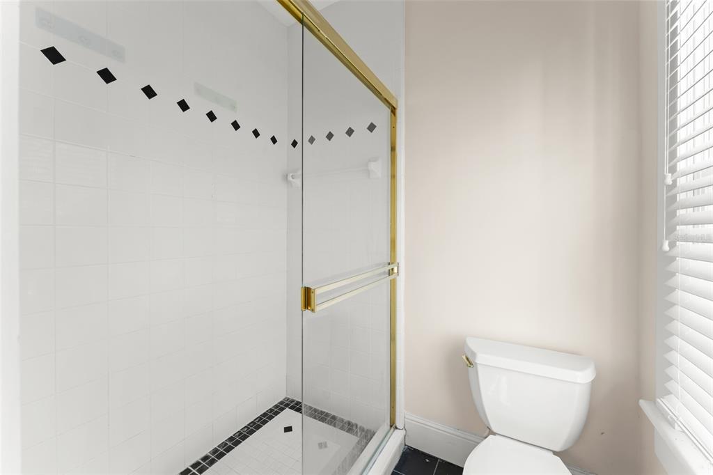 403 Water Street Celebration, FL 34747 - Photo 79 of 86 a bathroom with a toilet and a shower