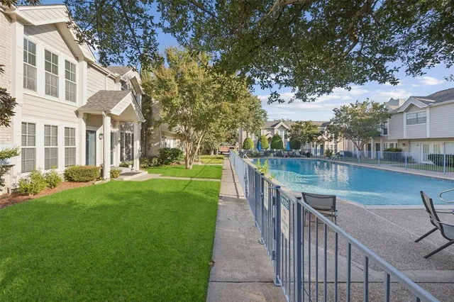 a view of a patio with a yard