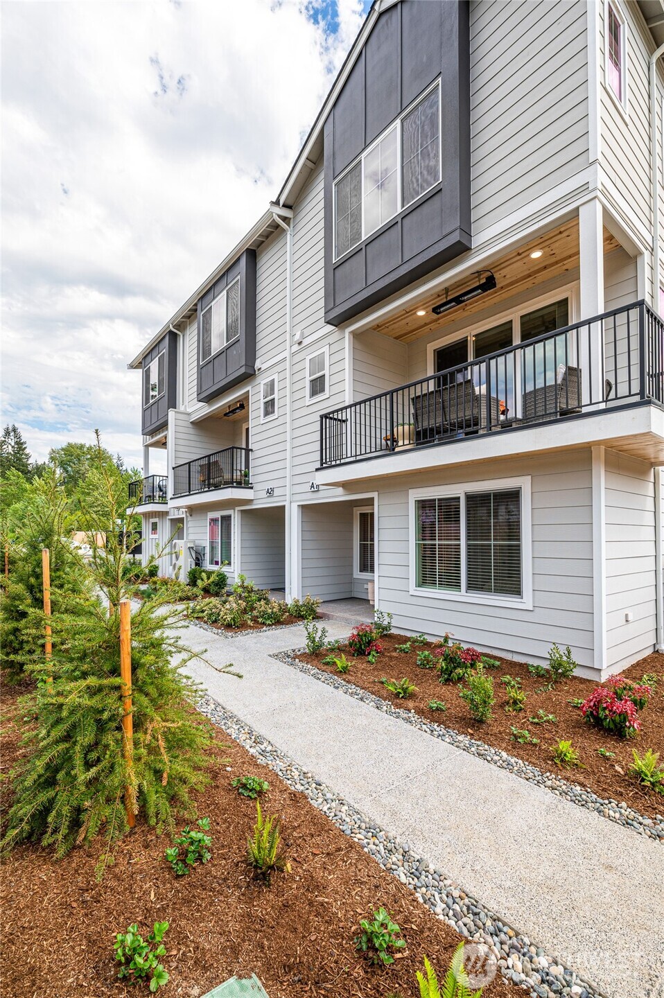 1322 194th Street Southeast, Unit E6 Bothell, WA 98012 - Photo 2 of 17 a front view of a building