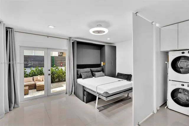 a living room with furniture and a ceiling fan