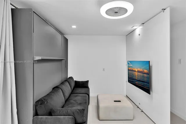 a living room with a couch and a window