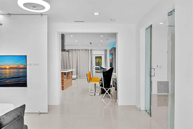 a bedroom with a bed and a mirror