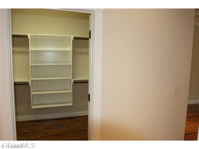 8902 West Pepper Court Oak Ridge, NC 27310 - Photo 10 of 16 Master Bedroom. The room-sized master closet features solid shelving. Solid shelving is found in every closet/pantry in the home.