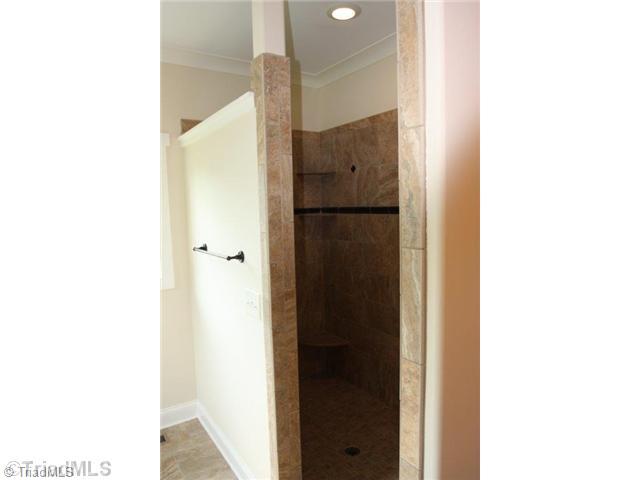 8902 West Pepper Court Oak Ridge, NC 27310 - Photo 9 of 16 Master Bath/Spa. The Master shower is oversized and does not require a door. Throw away your squeegee...no need for it here.