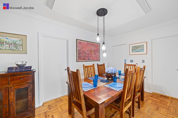 45 West 54th Street, Unit 3C Manhattan, NY 10019 - Photo 2 of 13 a dining room with furniture and wooden floor