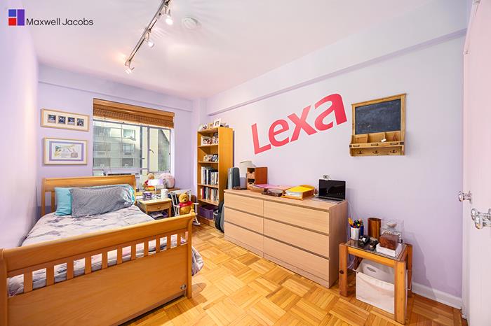 45 West 54th Street, Unit 3C Manhattan, NY 10019 - Photo 9 of 13 a bedroom with furniture and a window