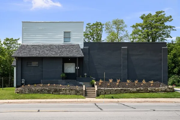 a front view of house with a yard