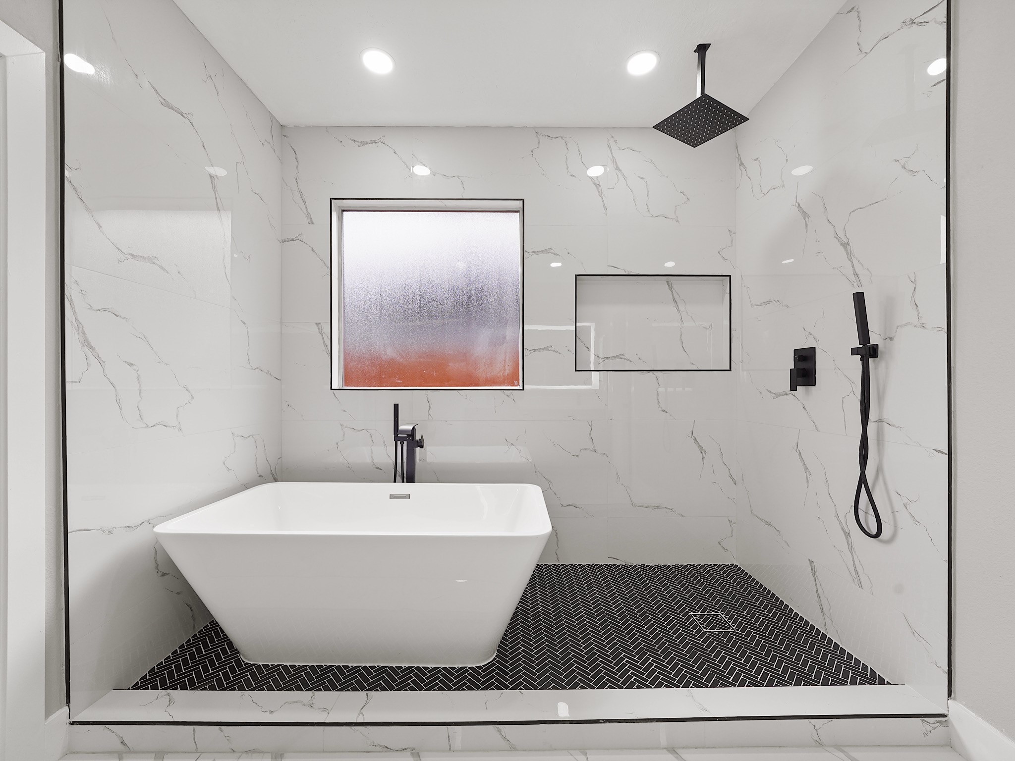 25007 Butterwick Drive Spring, TX 77389 - Photo 18 of 22 a bathroom with a bathtub and a shower