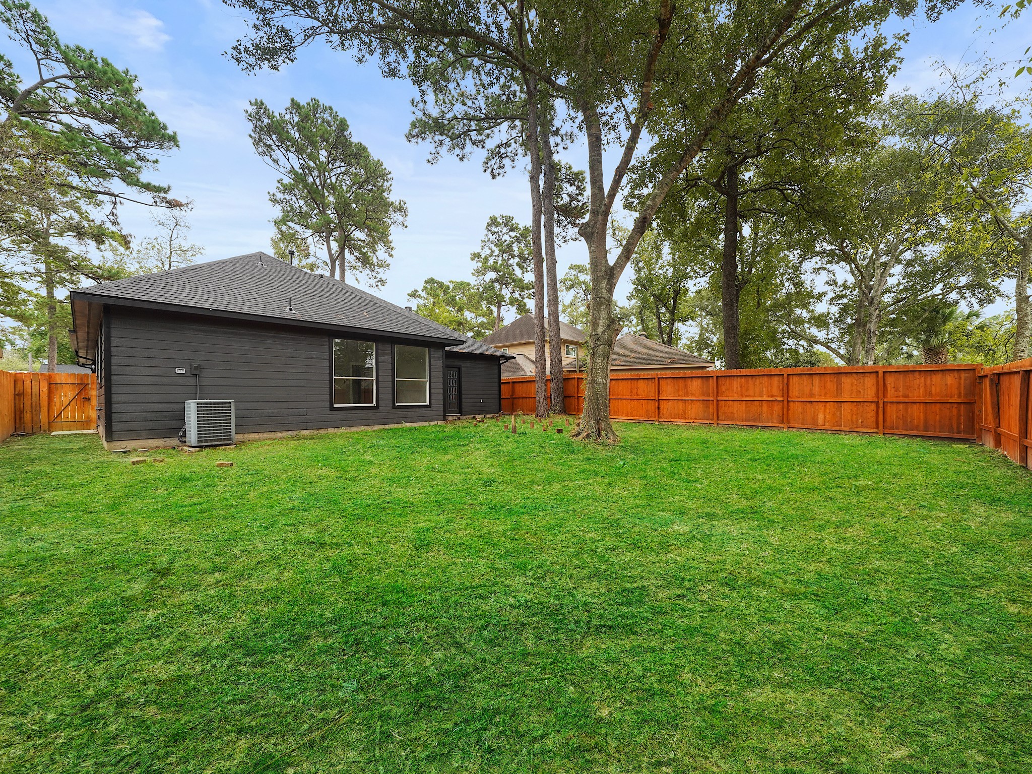 25007 Butterwick Drive Spring, TX 77389 - Photo 21 of 22 a front view of house with yard and outdoor seating