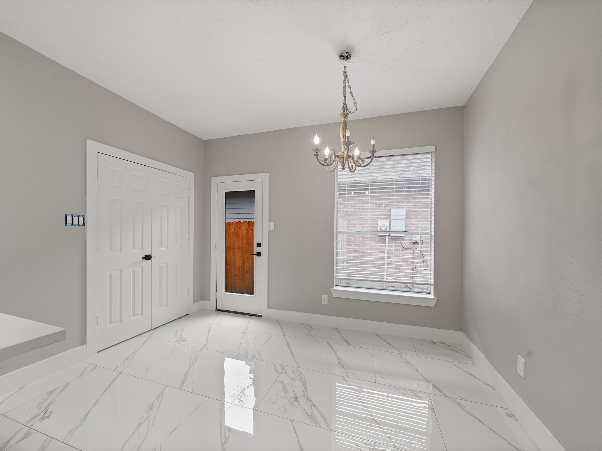 25007 Butterwick Drive Spring, TX 77389 - Photo 8 of 22 a view of an empty room with window and chandelier fan