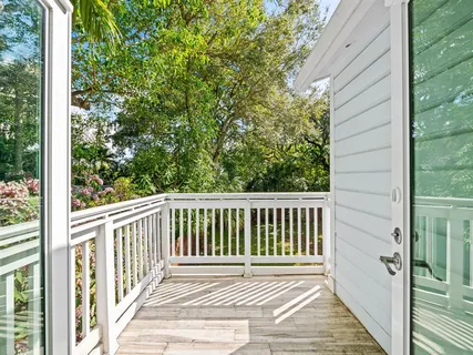 a view of a wooden balcony with a pot