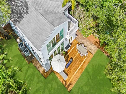 an aerial view of residential house with pool