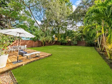 a view of a backyard with a patio