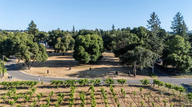 an aerial view of residential house and sandy dunes