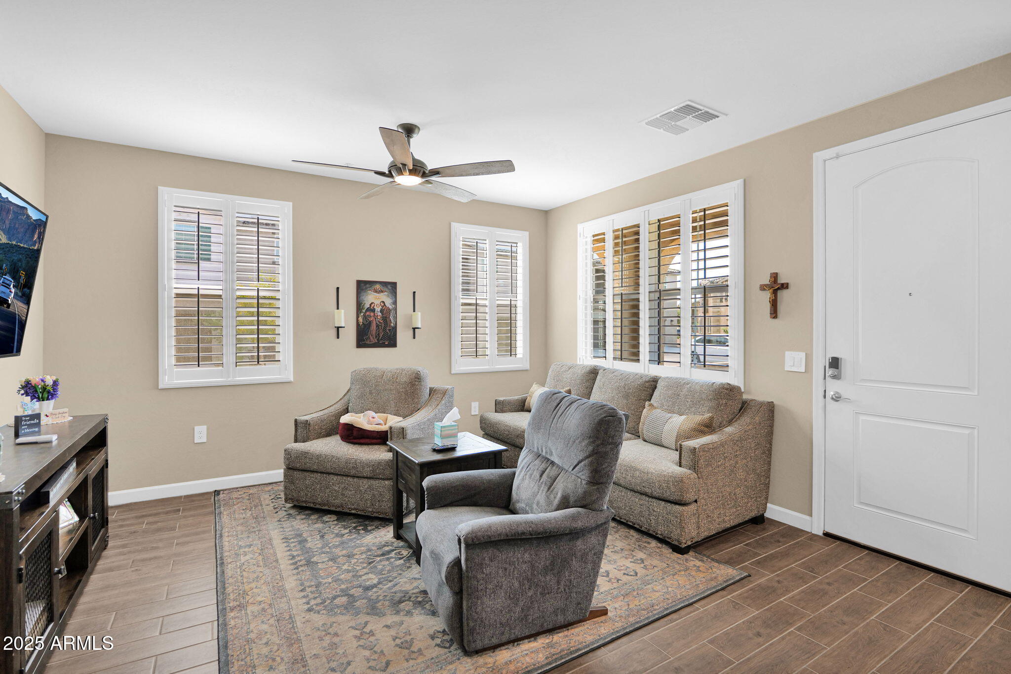 1255 North Arizona Avenue, Unit 1289 Chandler, AZ 85225 - Photo 11 of 32 a living room with furniture and large windows