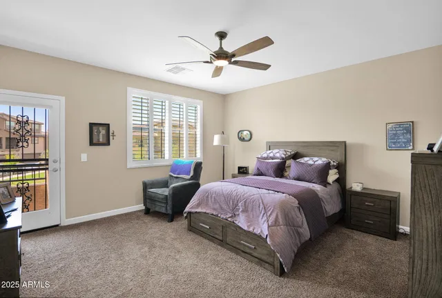 a spacious bedroom with a bed and a window