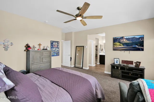 a bedroom with a bed and dresser