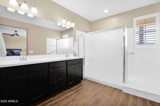 a bathroom with a double vanity sink mirror and vanity