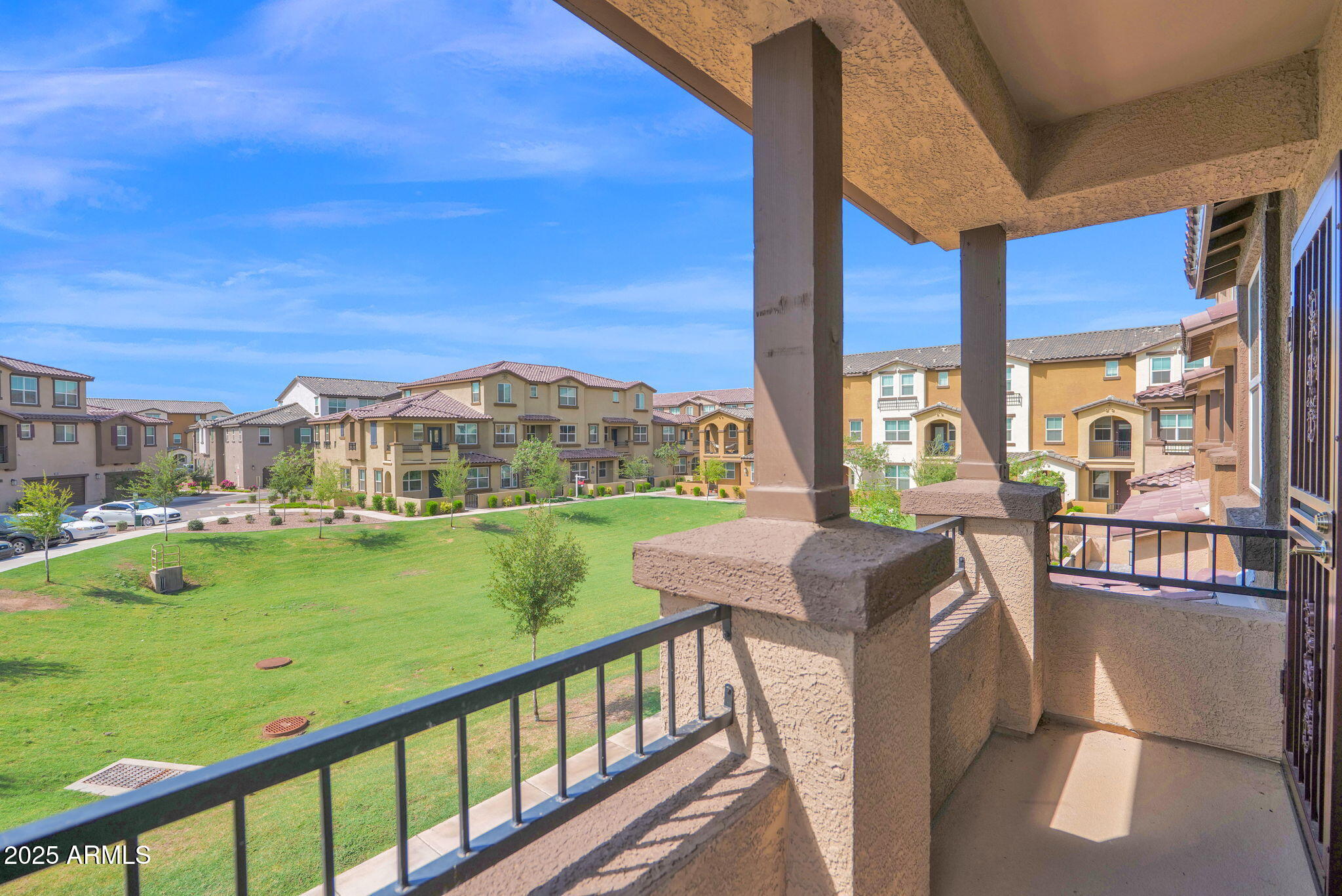 1255 North Arizona Avenue, Unit 1289 Chandler, AZ 85225 - Photo 21 of 32 a view of a balcony with table and chairs