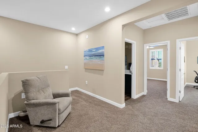 a living room with furniture and a rug