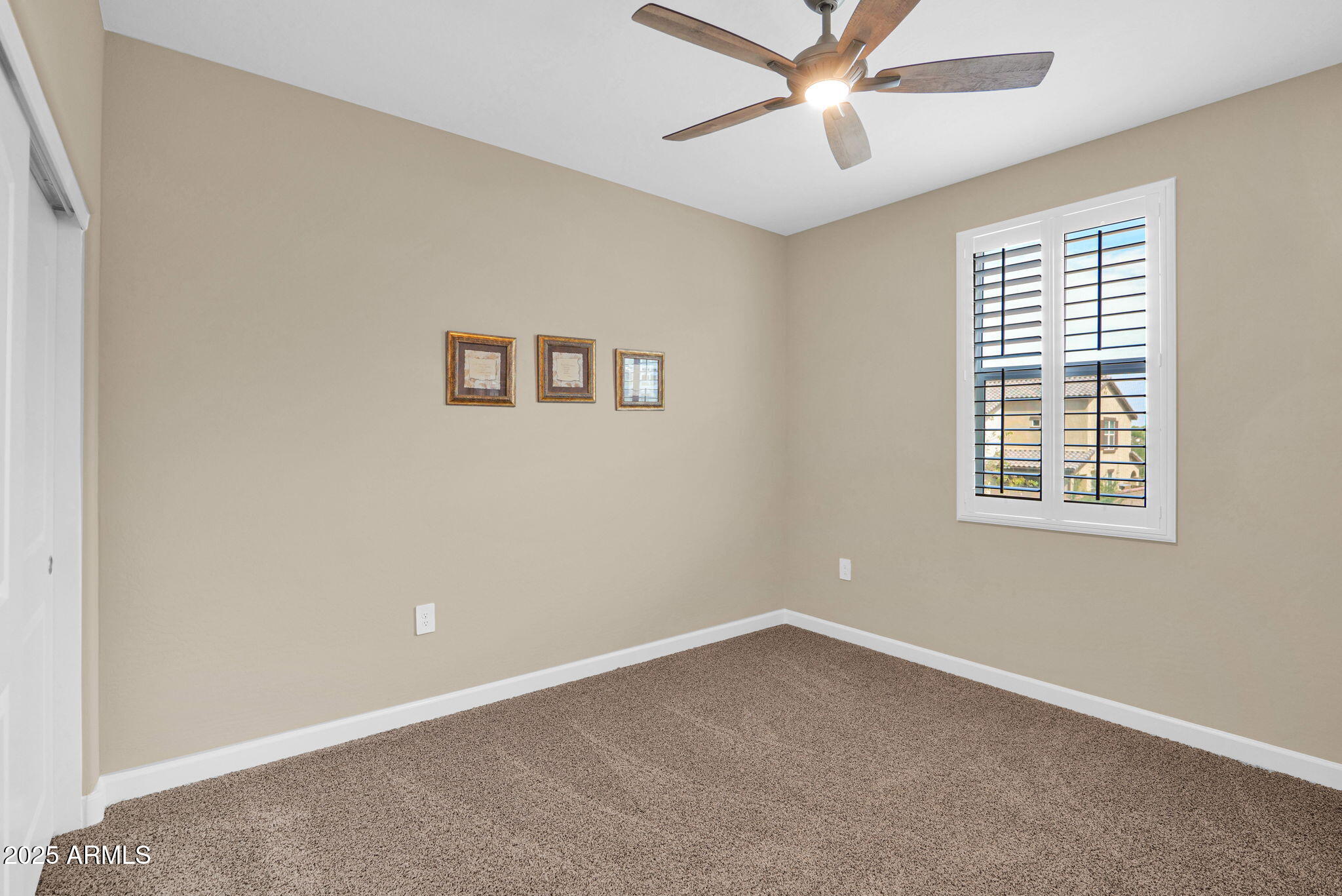1255 North Arizona Avenue, Unit 1289 Chandler, AZ 85225 - Photo 24 of 32 an empty room with windows and fan