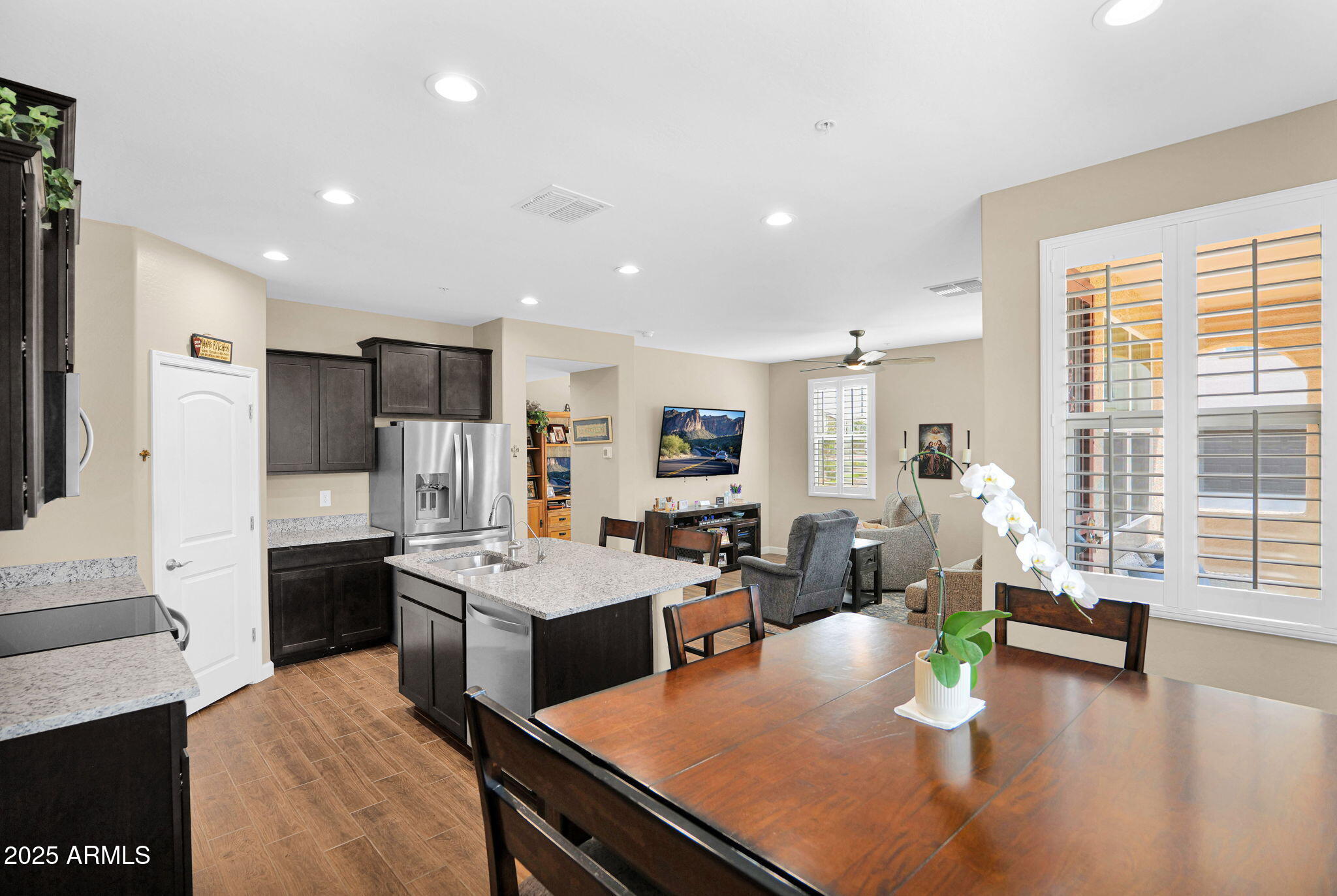 1255 North Arizona Avenue, Unit 1289 Chandler, AZ 85225 - Photo 8 of 32 a living room with stainless steel appliances furniture a rug kitchen view and a large window