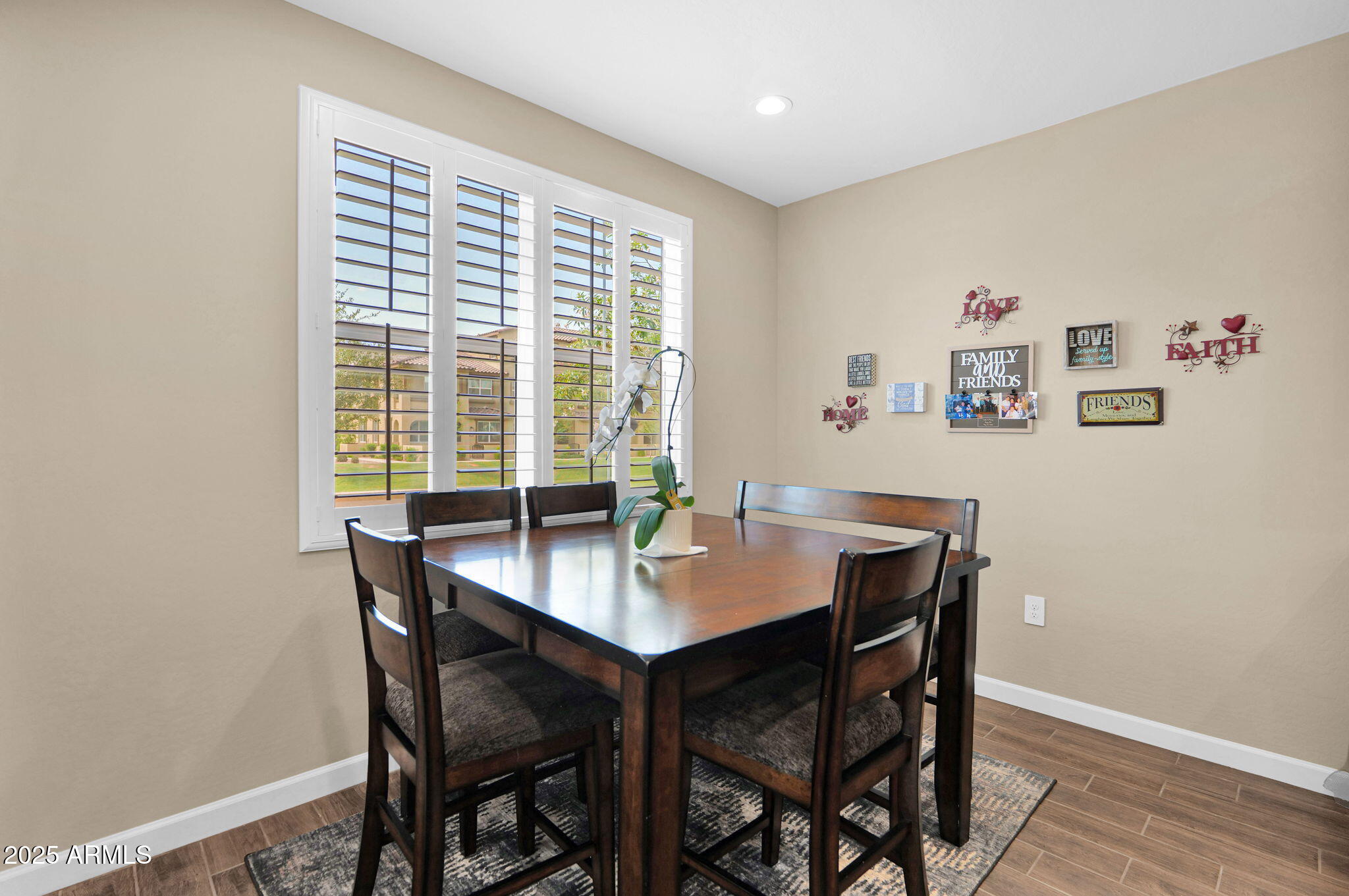 1255 North Arizona Avenue, Unit 1289 Chandler, AZ 85225 - Photo 9 of 32 a view of a dining room with a table and chairs