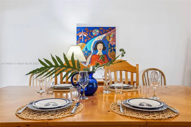 a bedroom with a bed and a table