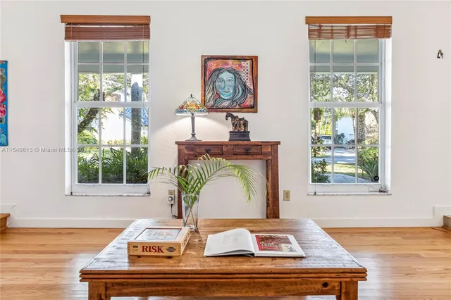 a bedroom with a bed and a table