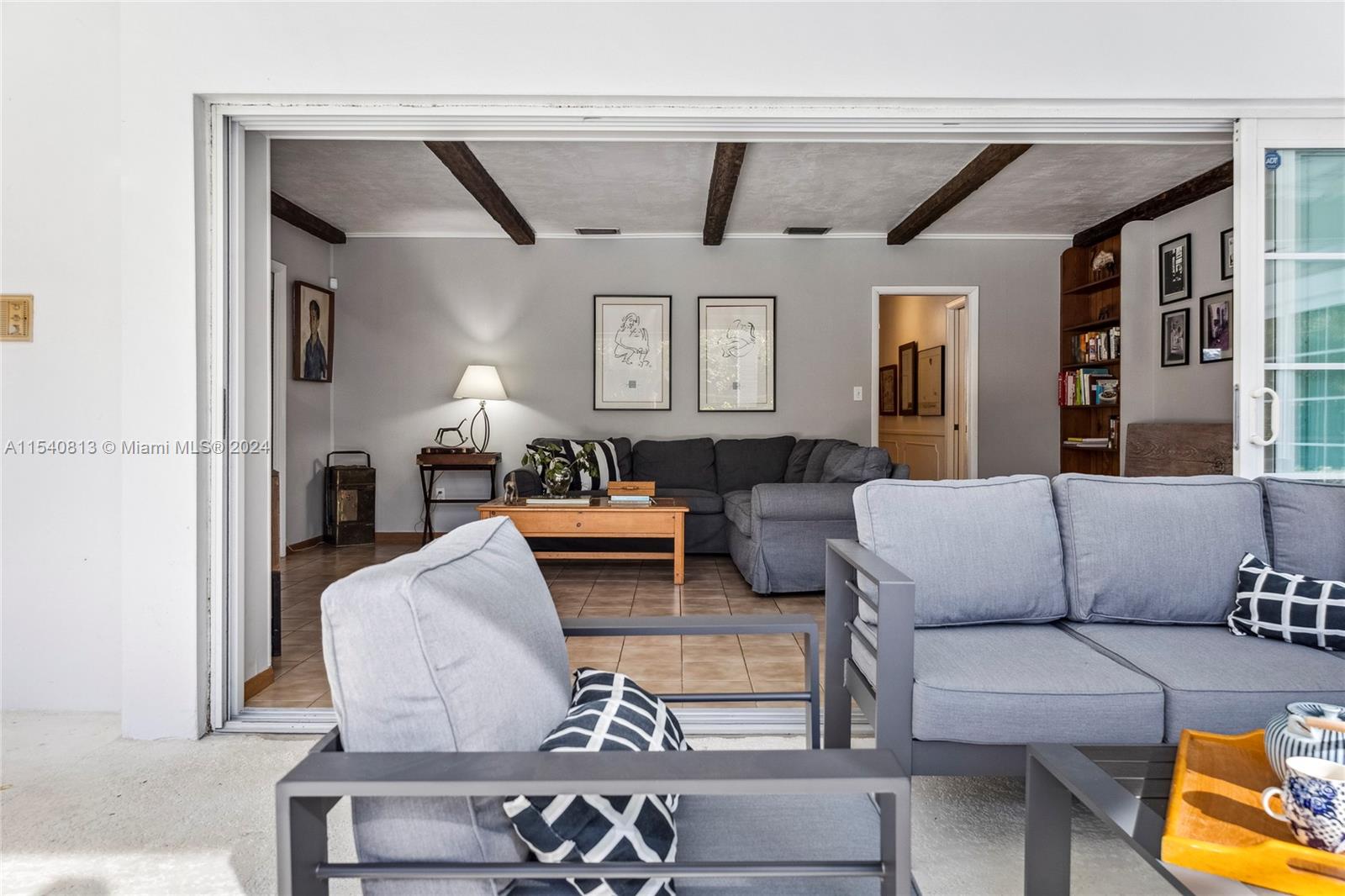 10130 Southwest 70th Avenue Pinecrest, FL 33156 - Photo 20 of 75 a living room with furniture and a fireplace