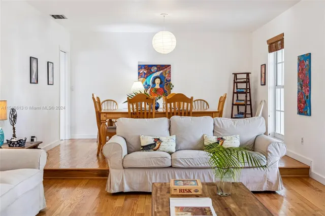 a living room with furniture and a rug