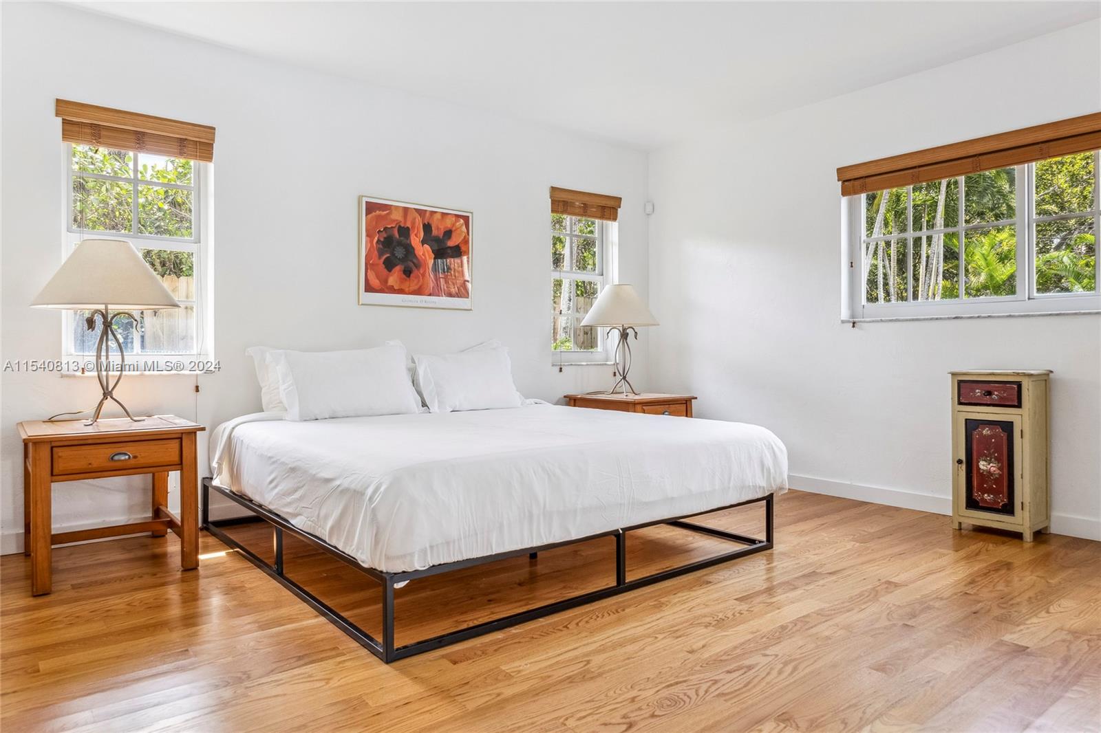 10130 Southwest 70th Avenue Pinecrest, FL 33156 - Photo 22 of 75 a bedroom with a bed and a table